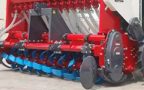 Close-up of Rattan Super Seeder rotor blades, seed tubes and side discs